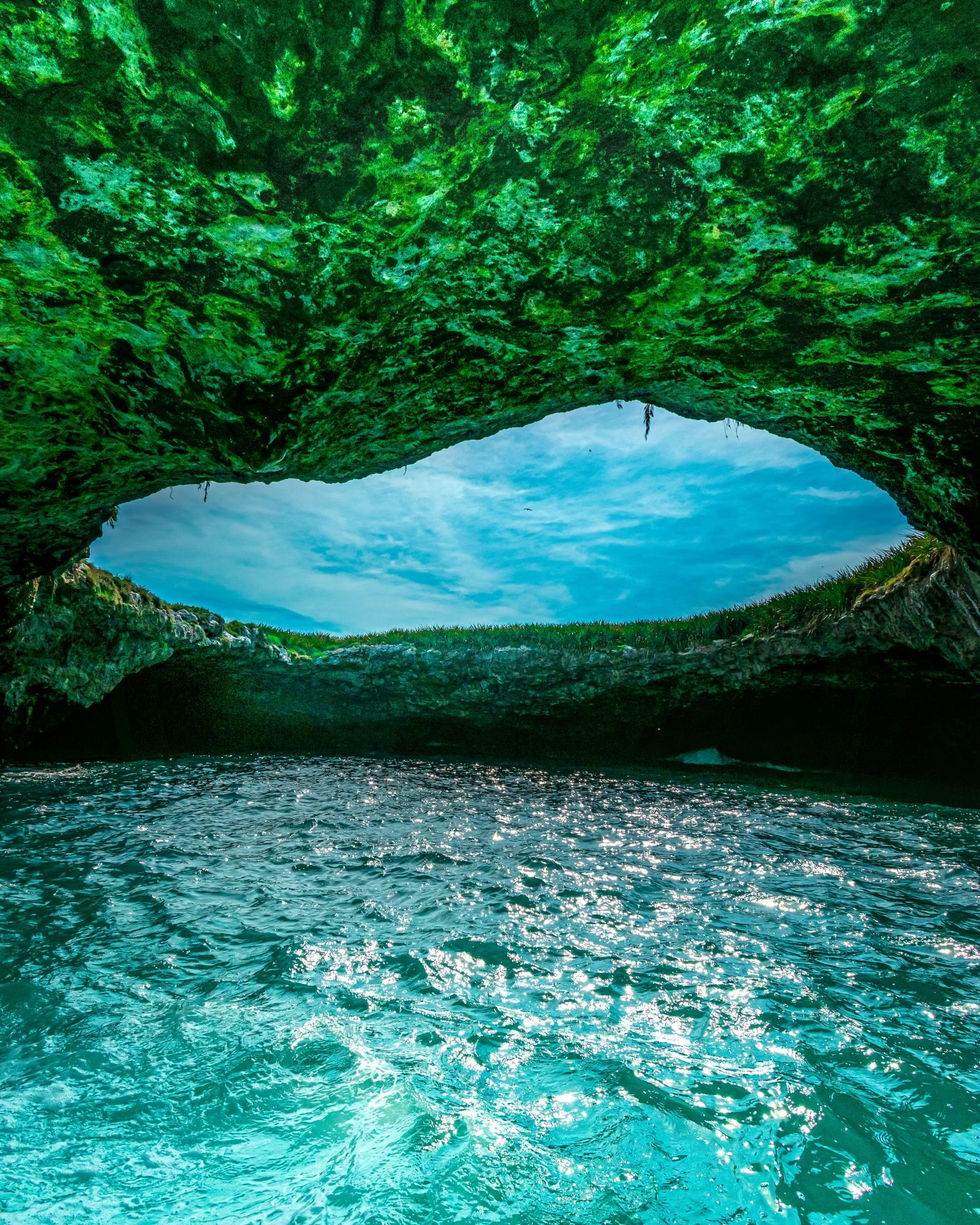 View from inside the cave at Hidden Beach in the Marietas Islands, with turquoise water and sky beyond