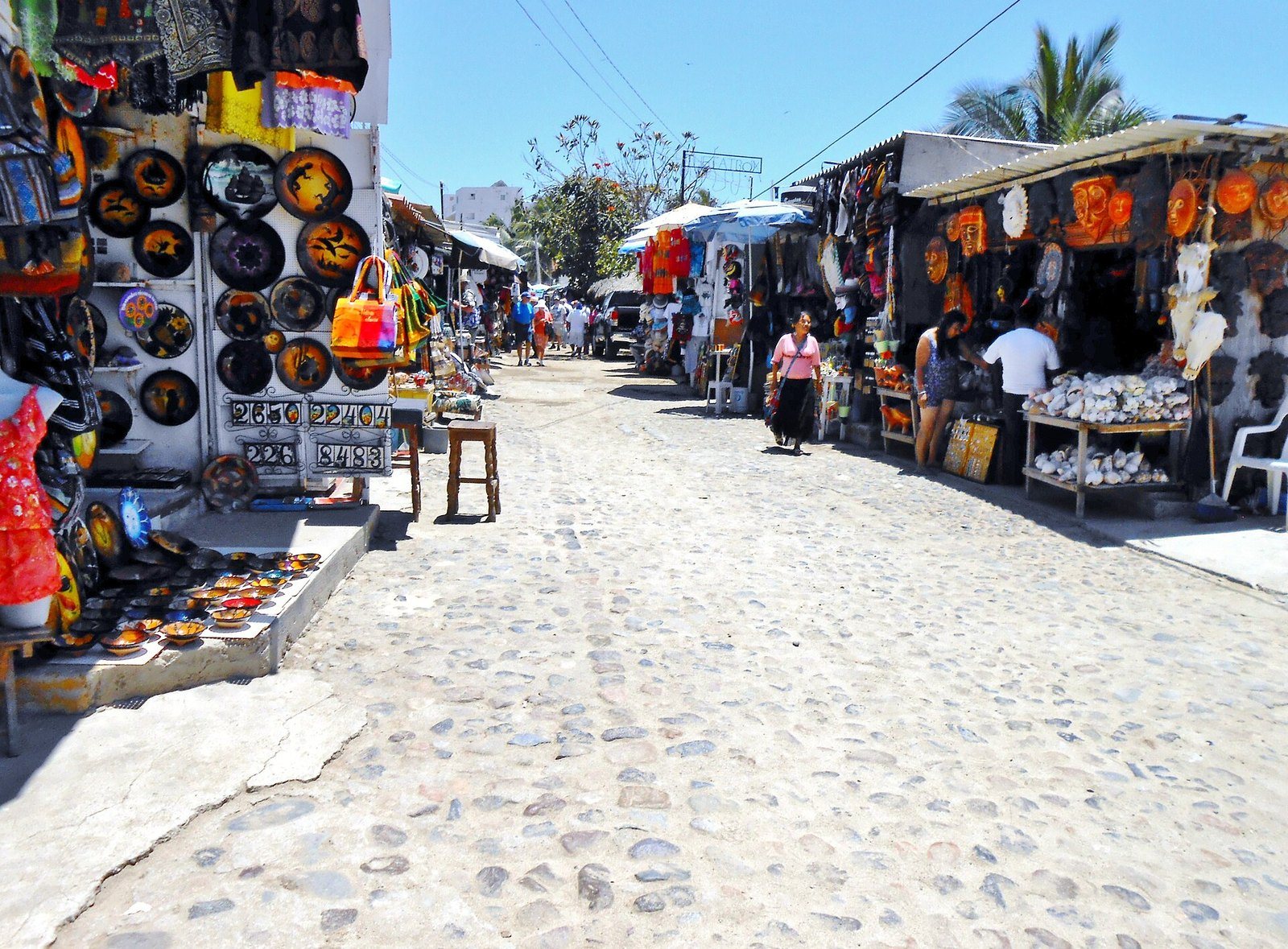 Mexican handicraft stalls along a cobblestone street in Bucerías